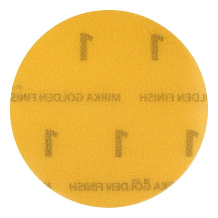 A round yellow disc with faded printed text and hook-and-loop attachment