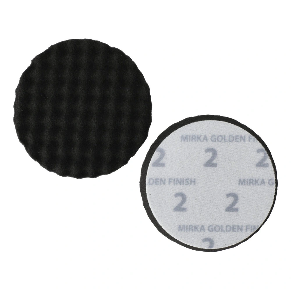 Two round finishing pads, black and white