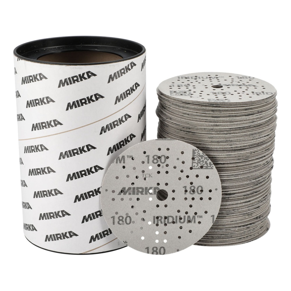 Branded cylindrical container beside a stack of sanding discs with one disc