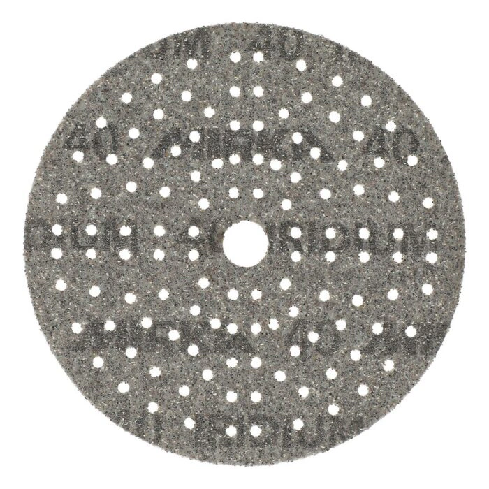 Gray circular sanding disc with many holes and a central hole on a white