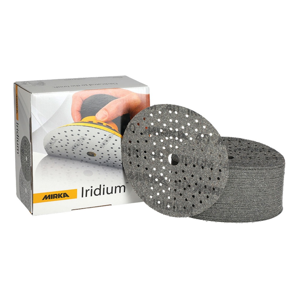Perforated sanding disc beside box and stack