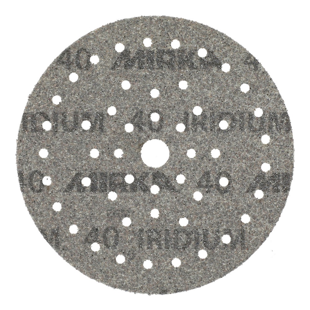 Dark gray round sanding disc with many holes and a rough textured surface