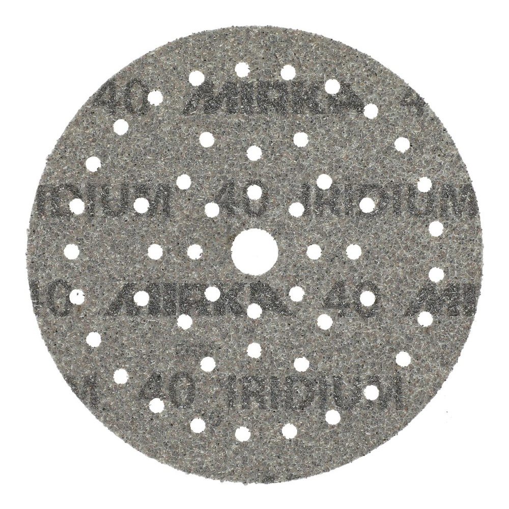 Dark gray round sanding disc with many holes and a rough textured surface