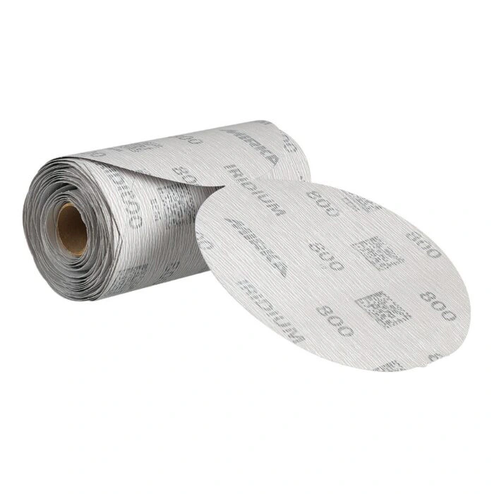A roll of white-gray sanding sheets with printed markings, with one sheet