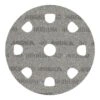 A gray round sanding disc with large arched holes and a center hole, seen