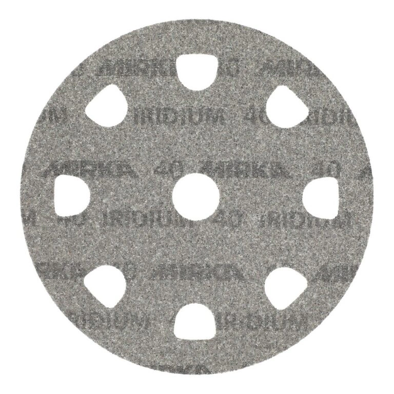 A gray round sanding disc with large arched holes and a center hole, seen