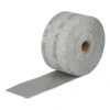 A large roll of abrasive material, wound on a cardboard core, with an open