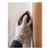 A gloved hand holds a yellow-and-black triangular sander in the corner