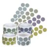 Four rolls of circular stickers in different colors, arranged together