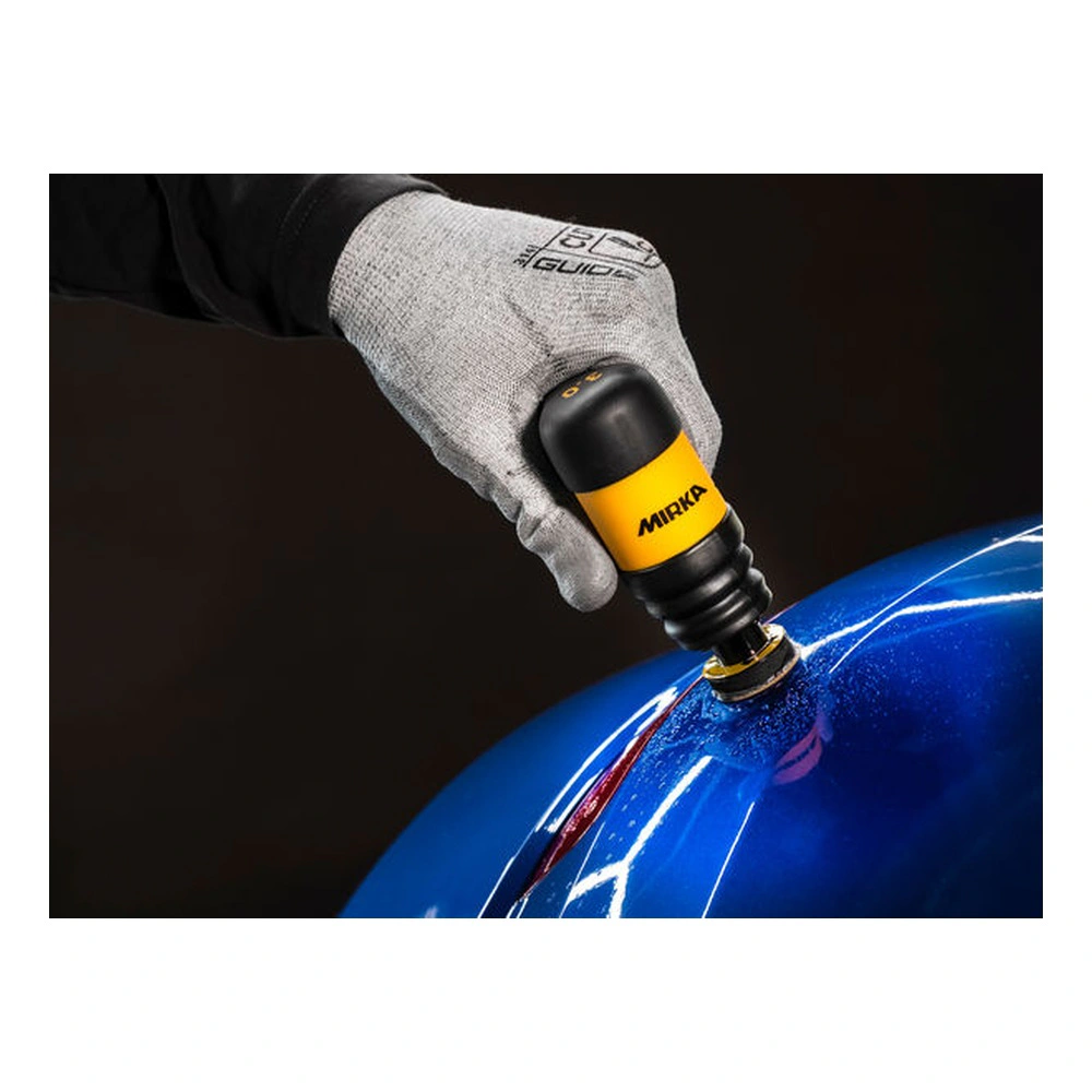 Gloved hand sanding a glossy blue surface