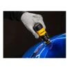 Gloved hand holding a yellow-and-black sanding tool against a glossy blue
