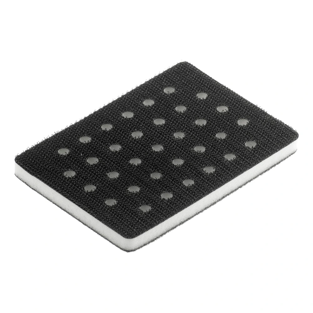 Black rectangular interface pad in an angled view, with round holes