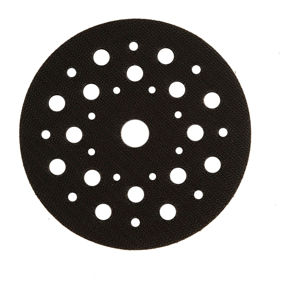 Black round perforated disc with holes in different sizes on a white