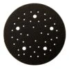Round black interface pad with many holes of different sizes, top view