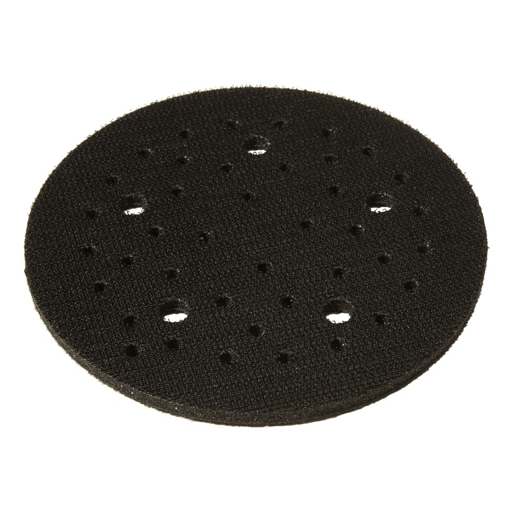 Black round pad with a slightly oval shape, small vent holes, and several