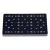Black rectangular interface pad with a dense hole pattern, top view