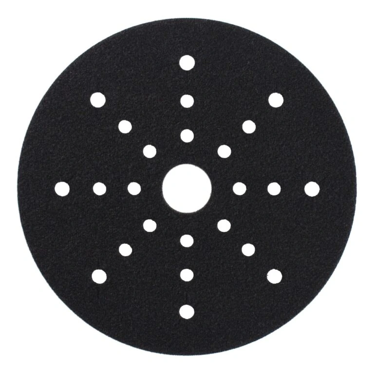 Round black interface pad with a center hole and additional holes arranged
