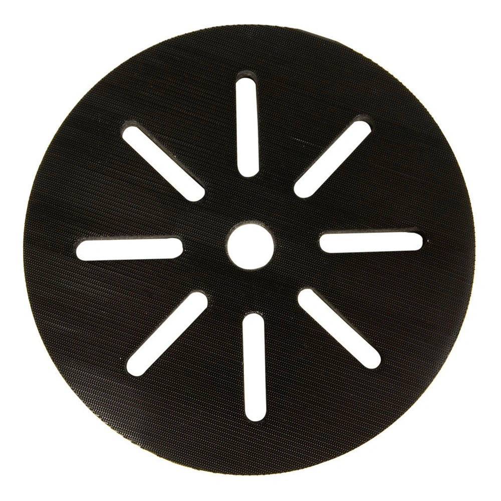 Round black interface pad with six radial slots and a center hole