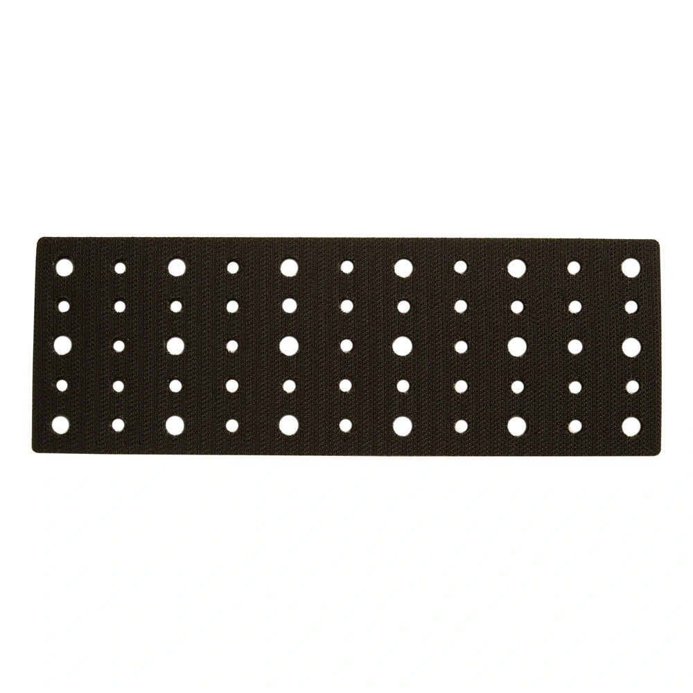 Black long rectangular interface pad with a dense hole pattern on a white