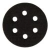Small round black interface pad with six holes on a white background