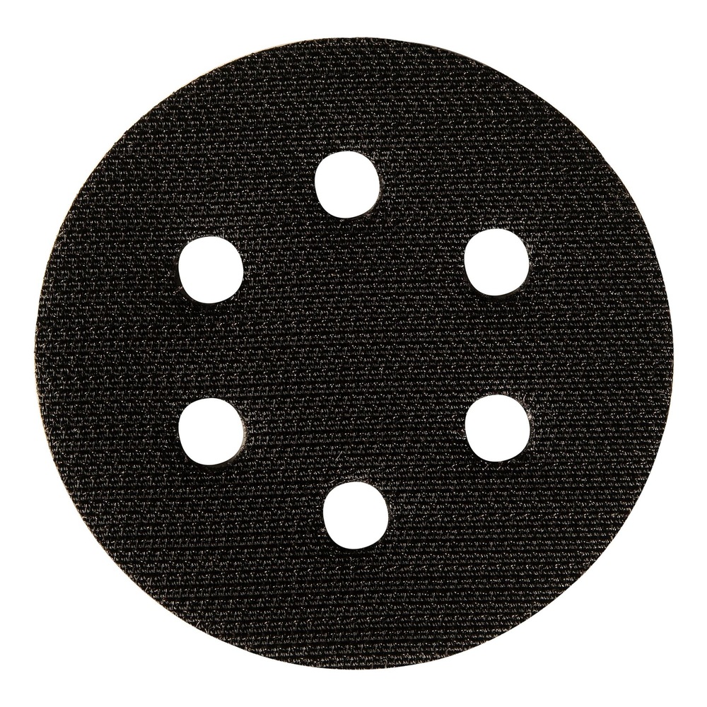 Small round black interface pad with six holes on a white background