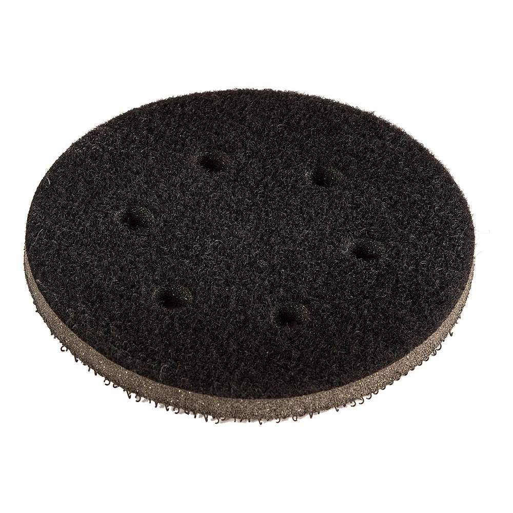 Round black interface pad with a fibrous surface and several small holes