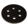 Round black interface pad with six holes, viewed from above on a white