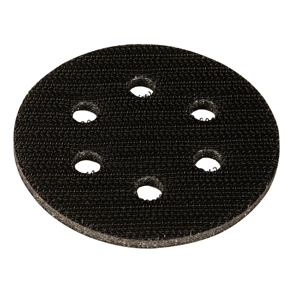 Round black interface pad with six holes, viewed from above on a white
