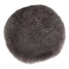 A round, dense gray-black wool pad shown in close-up on a white background