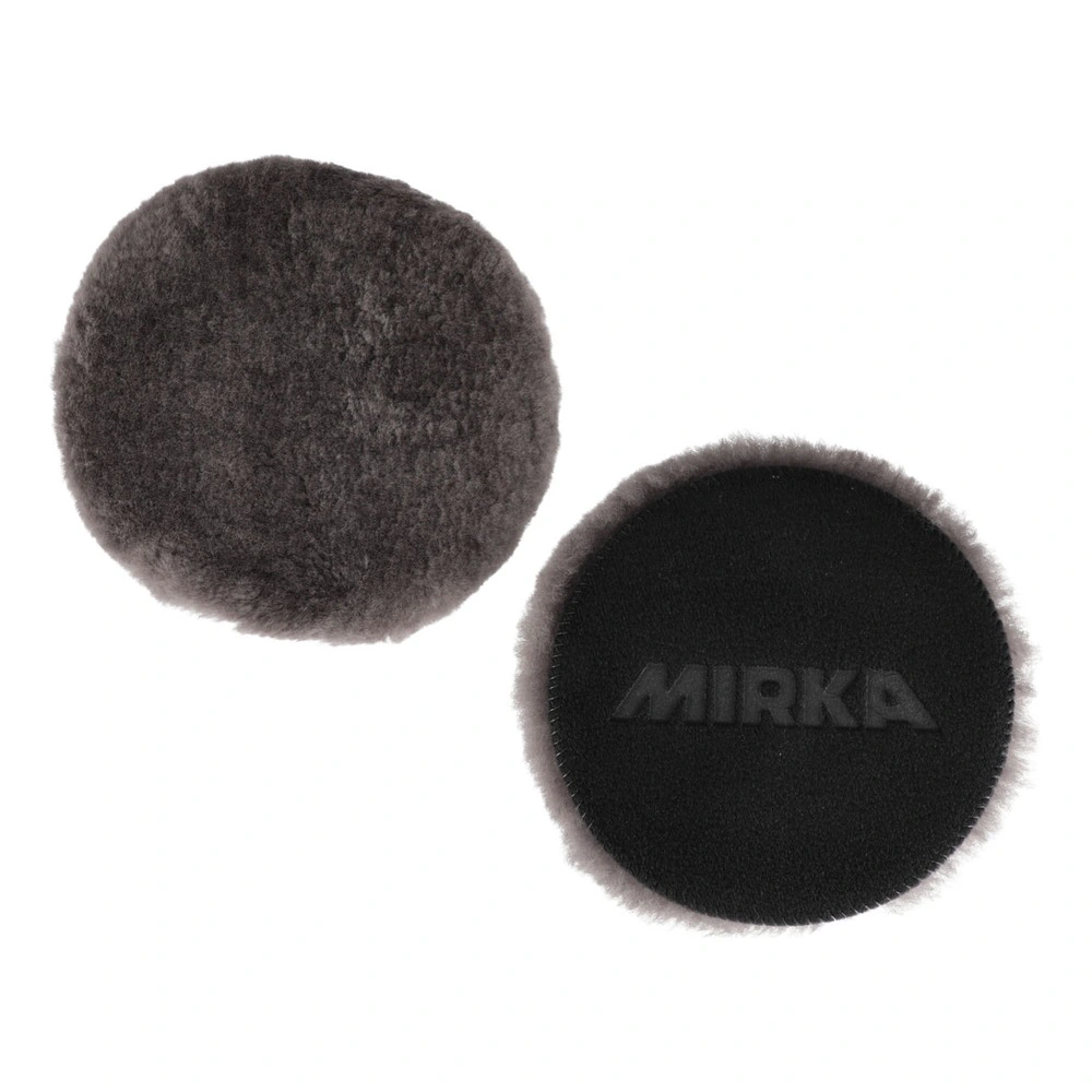 Two dark round lambswool pads, one with a black backing and visible MIRKA