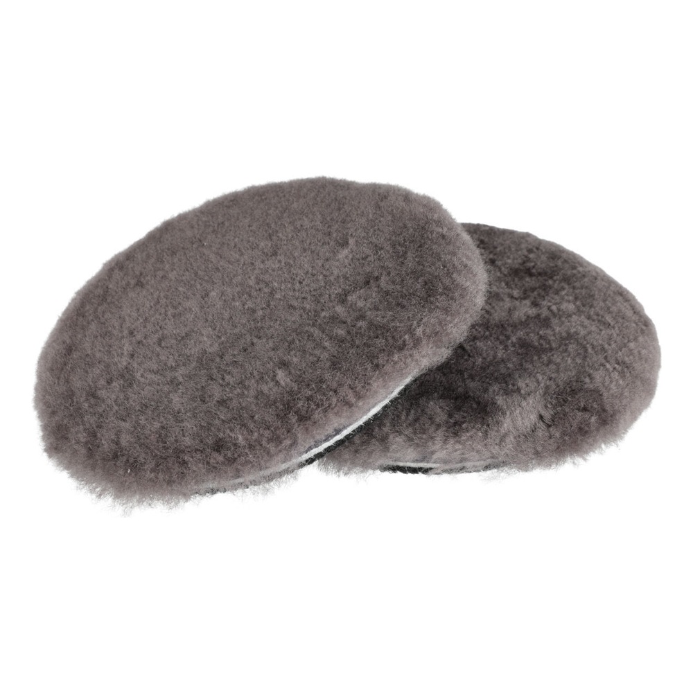 Two dark gray fluffy round pads, overlapping on a white background