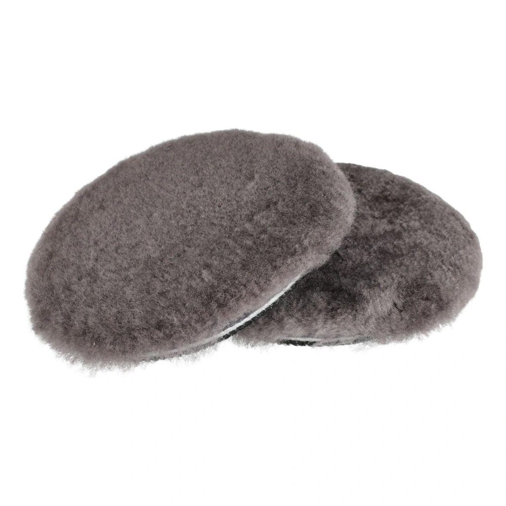 Two dark gray fluffy round pads, overlapping on a white background