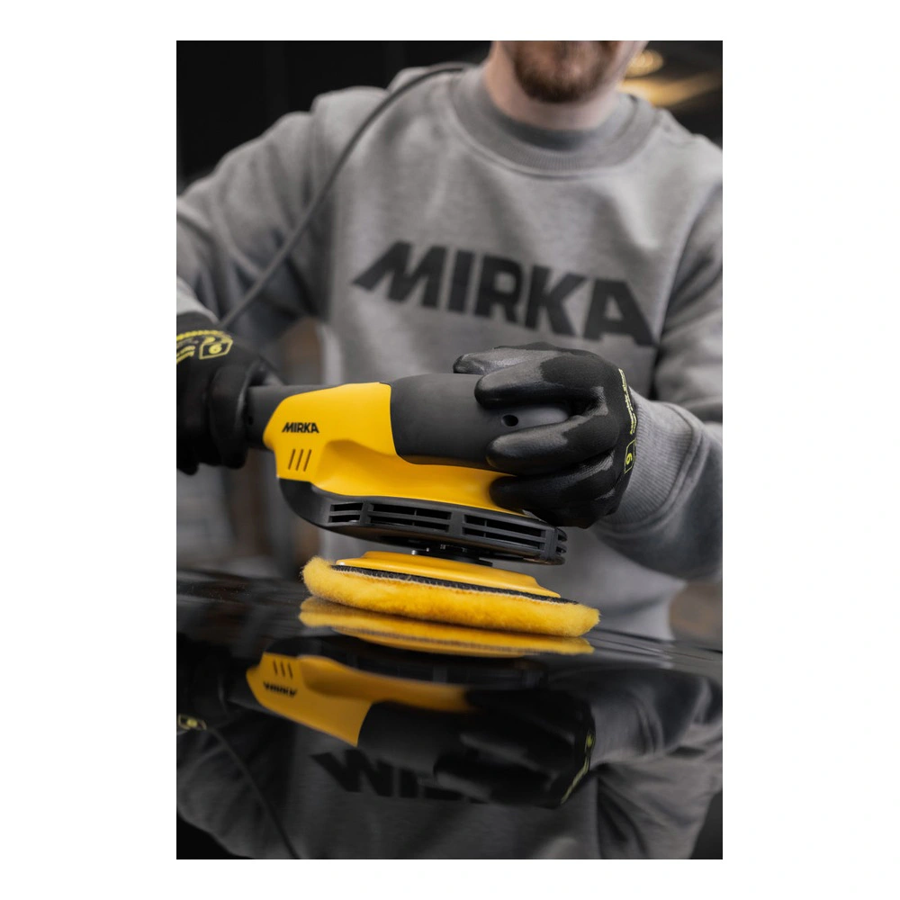Person using sander with yellow wool pad
