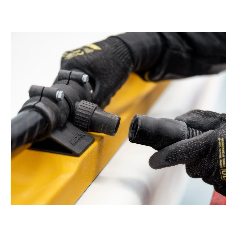 A close-up of the black attachment parts and clamps on the board