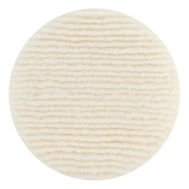 Round white wool pad, dense ribbed texture