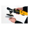 Hands holding a yellow-and-black handheld sander, with a white-and-black pad