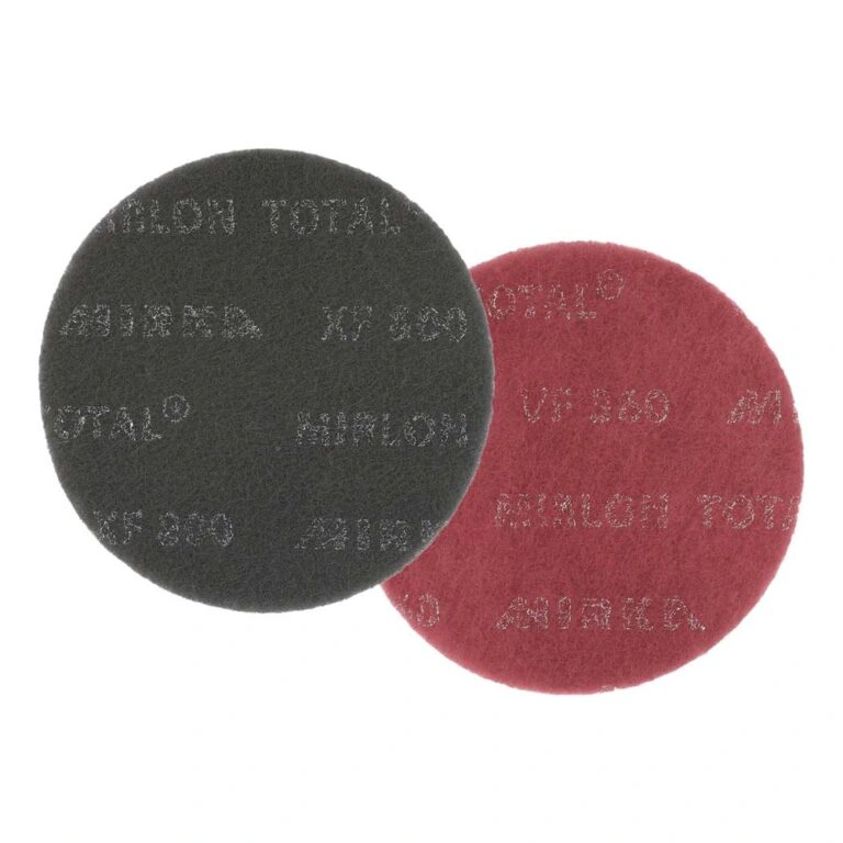 Two round sanding pads, black and red