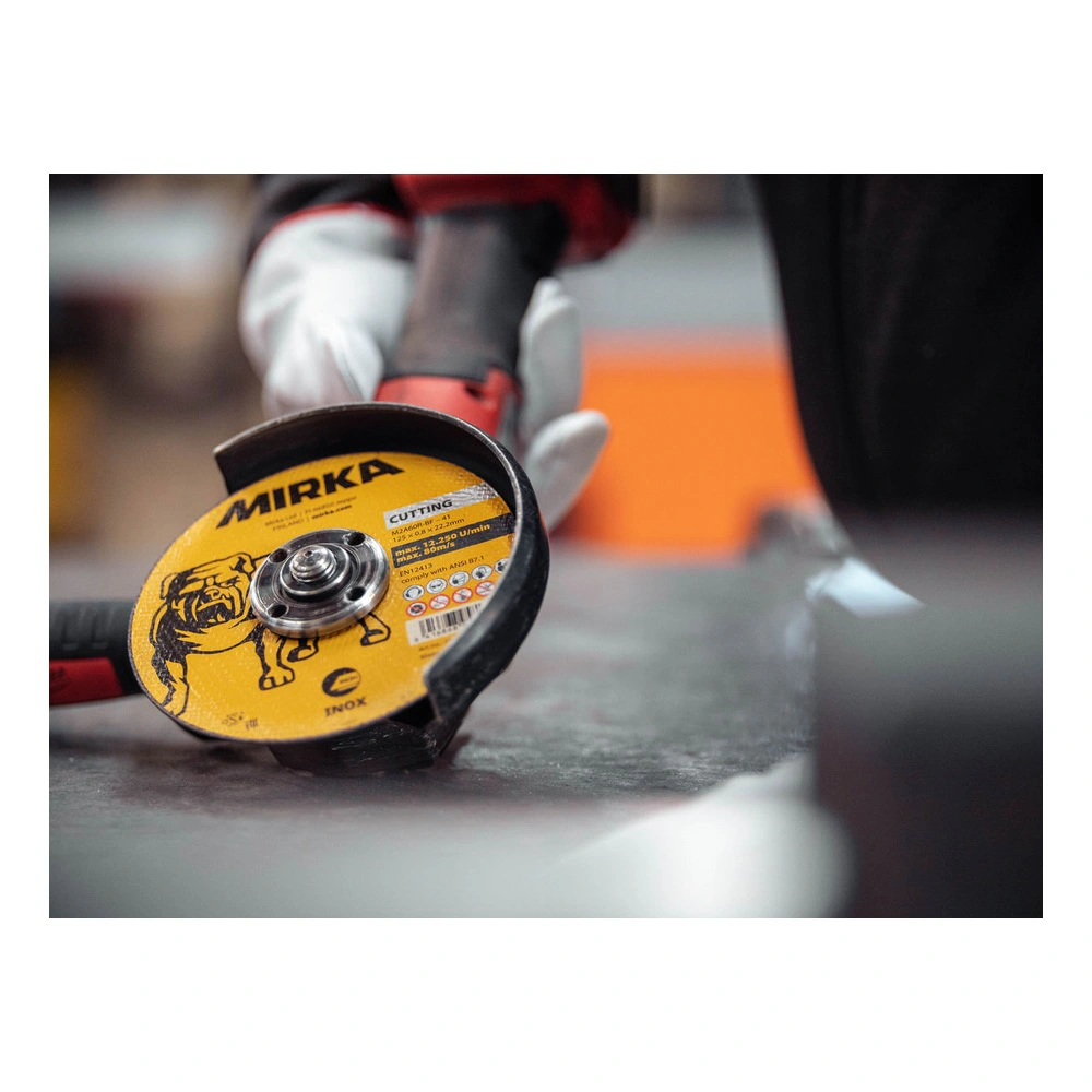 Angle grinder with cutting disc in use