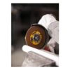 Gloved hand holding cutting disc on grinder