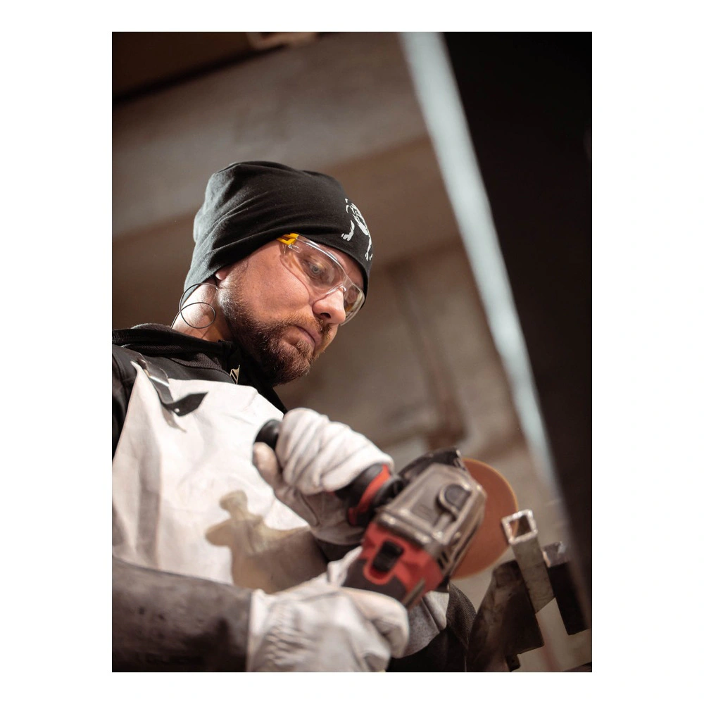 Person using angle grinder with eye protection