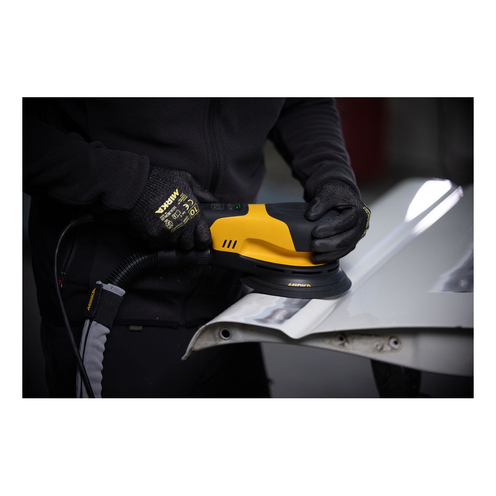 Person using a sander on a metal surface