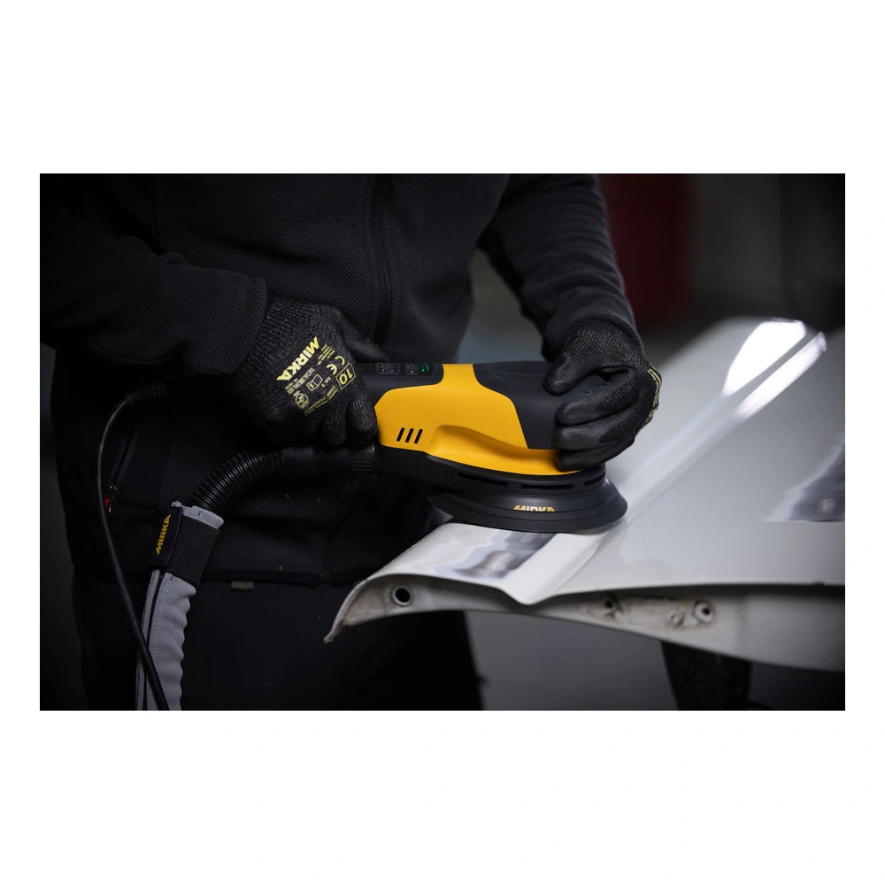 Person using a sander on a metal surface