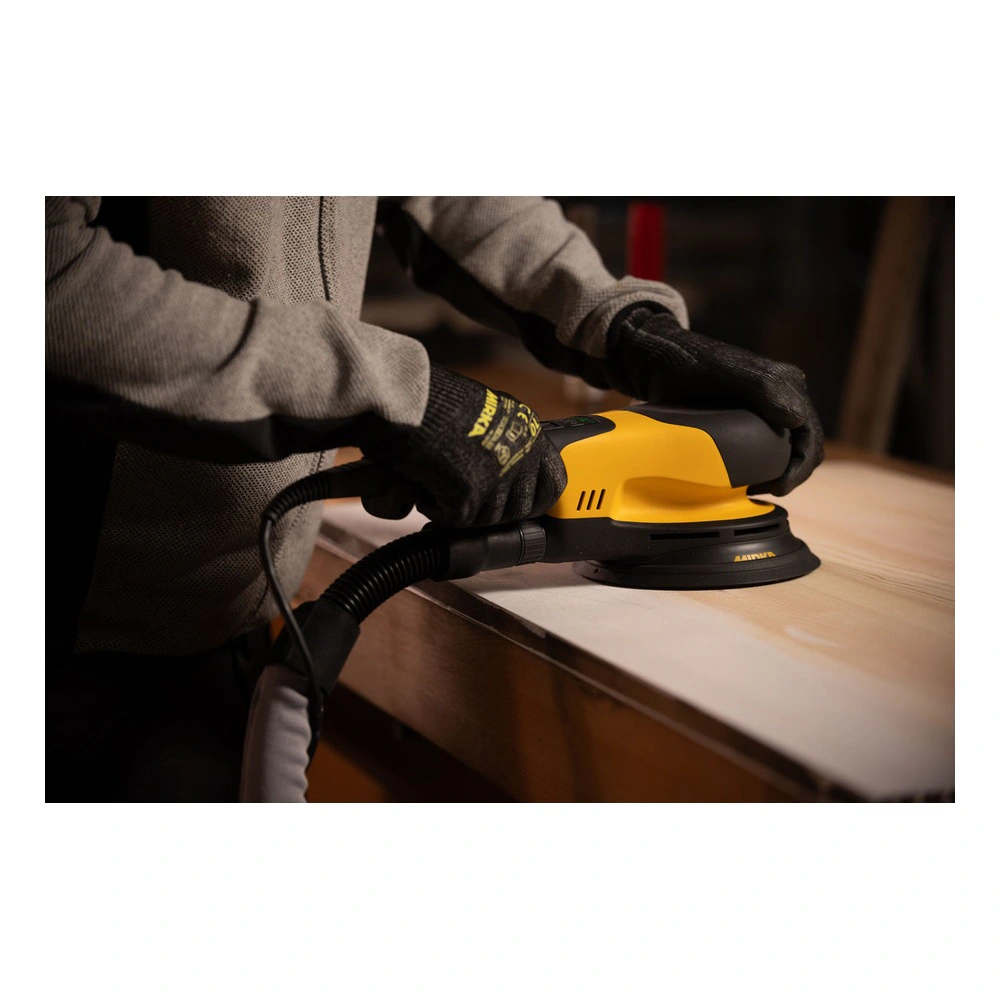 Person using a sander on a wooden surface