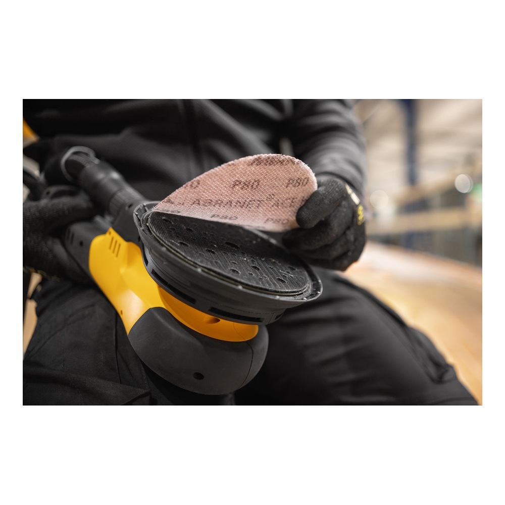 Handheld sander with sanding disc held up