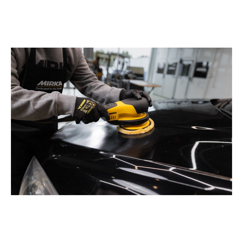 Person polishing a black car surface