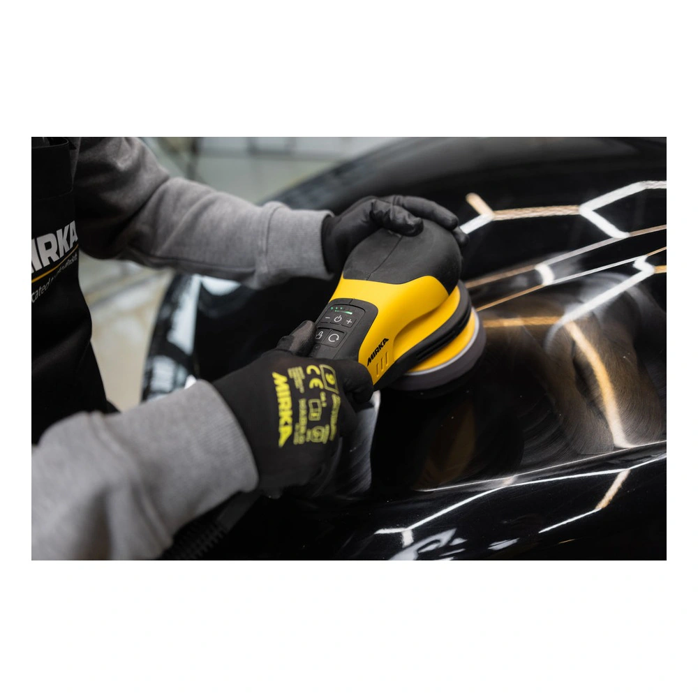 Rotary polisher on glossy car surface