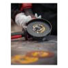Angle grinder with cutting wheel, gloved hands