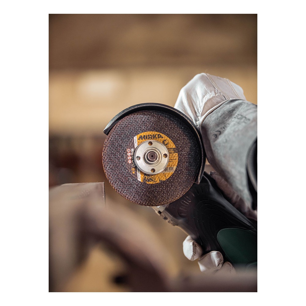 Cutting wheel shown in grinding use with glove