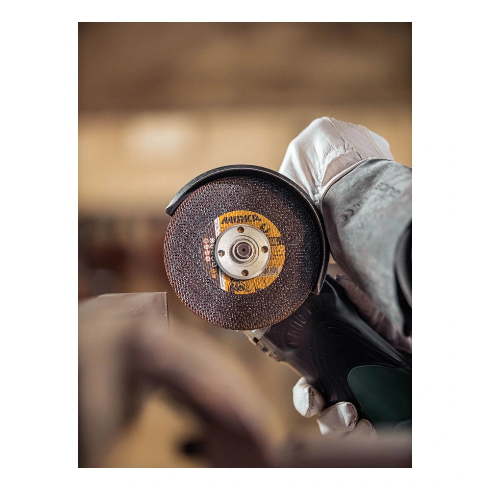 Cutting wheel shown in grinding use with glove