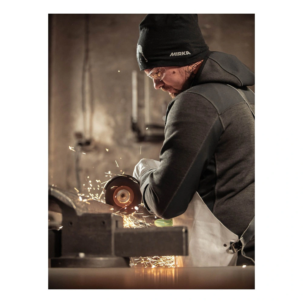 Person cutting metal with grinder and sparks